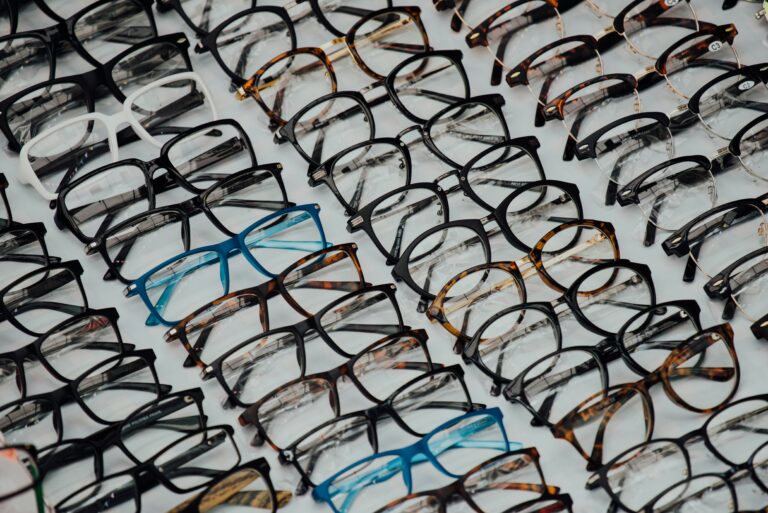 Rows of glasses frames displayed in an optician