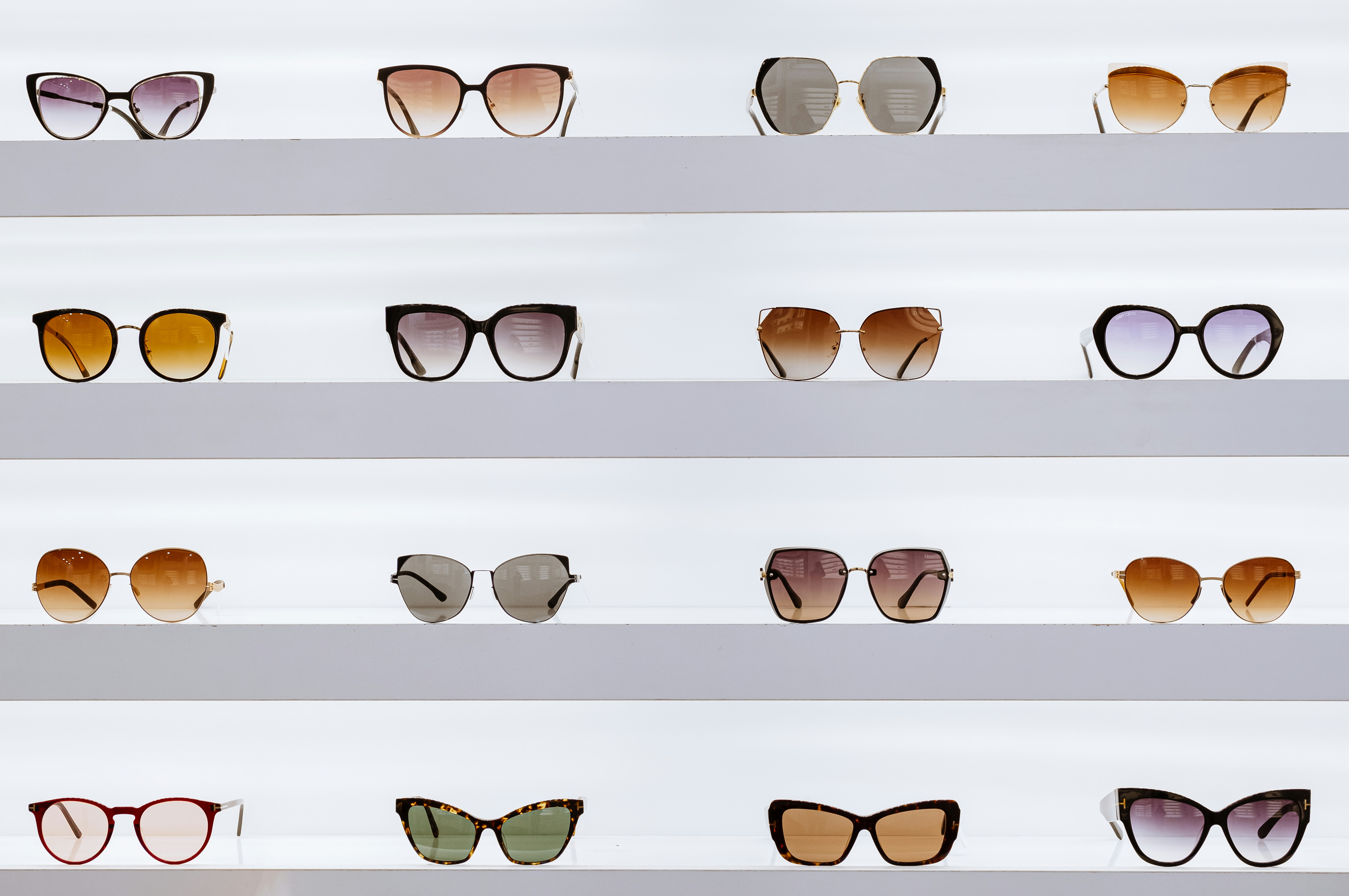 Rows of glasses frames displayed in an optician