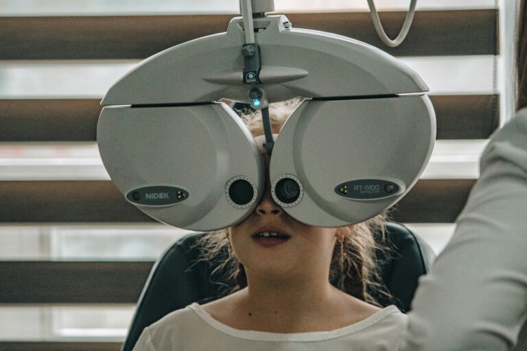 optometrist testing a child's eyes for myopia