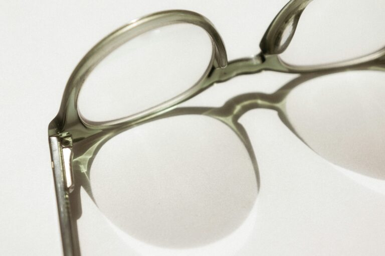 Black-framed glasses on a white surface, illustrating a Specscart vs Lentiamo price comparison