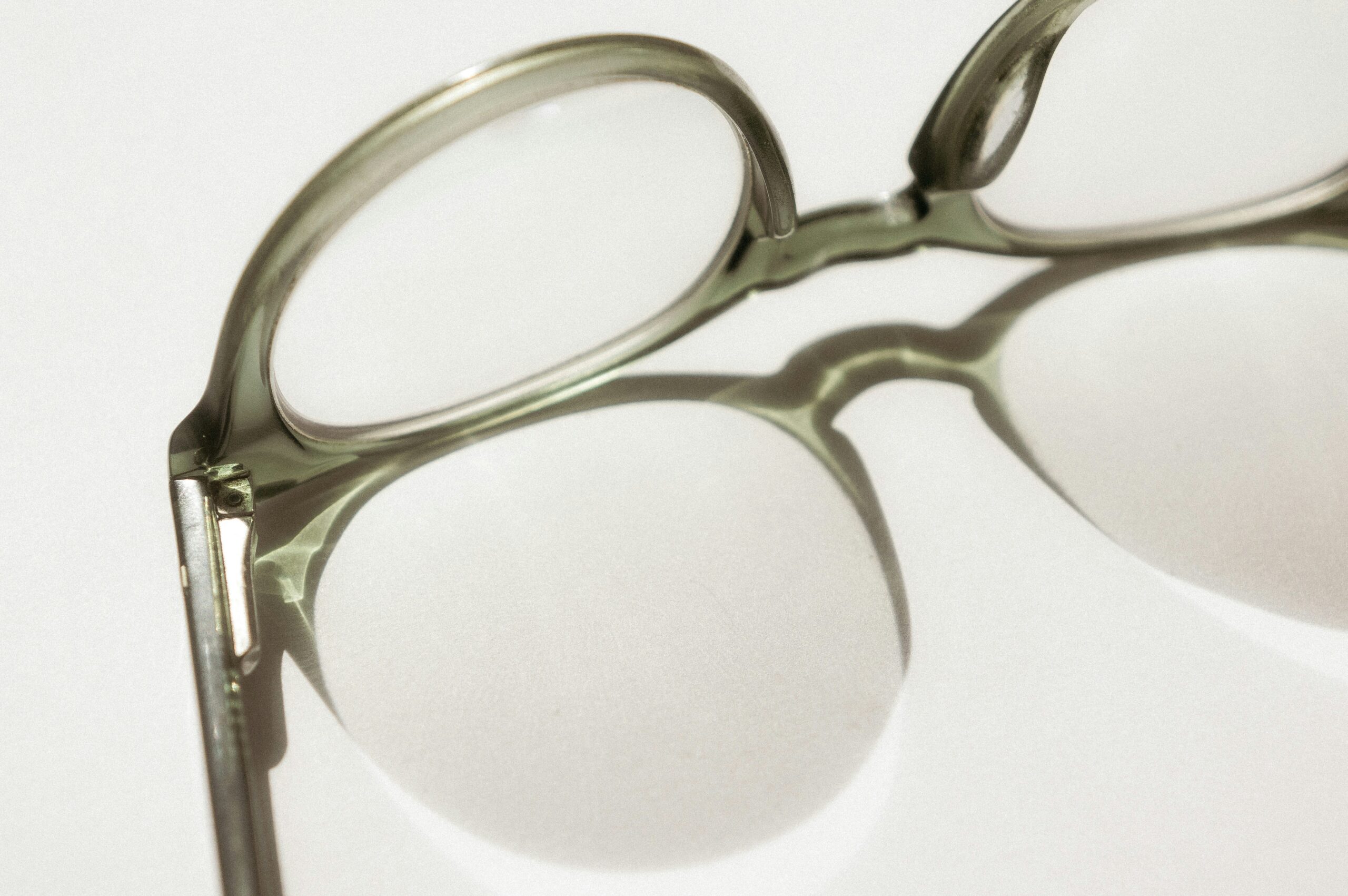 Black-framed glasses on a white surface, illustrating a Specscart vs Lentiamo price comparison