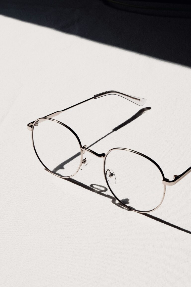 Varifocal glasses guide - minimal glasses with shadow on white.